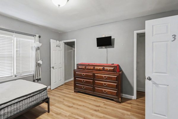 Haven North bedroom with dresser and TV